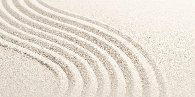 Sand wave nature textured background in wellness concept